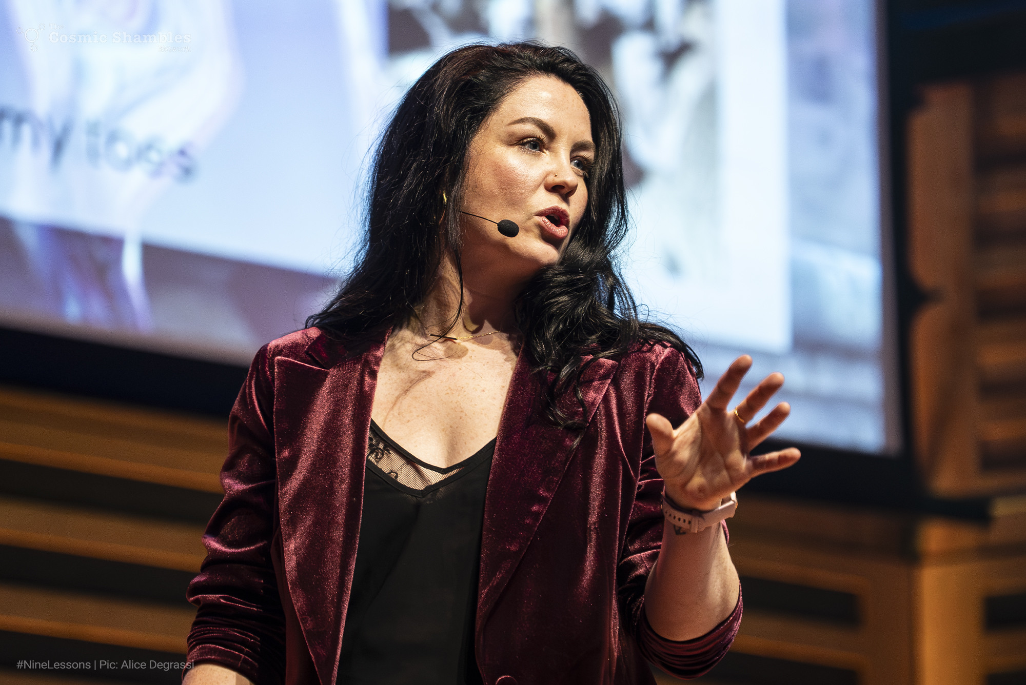 Dr Ami Sawran on stage at Nine Lessons and Carols for Curious People